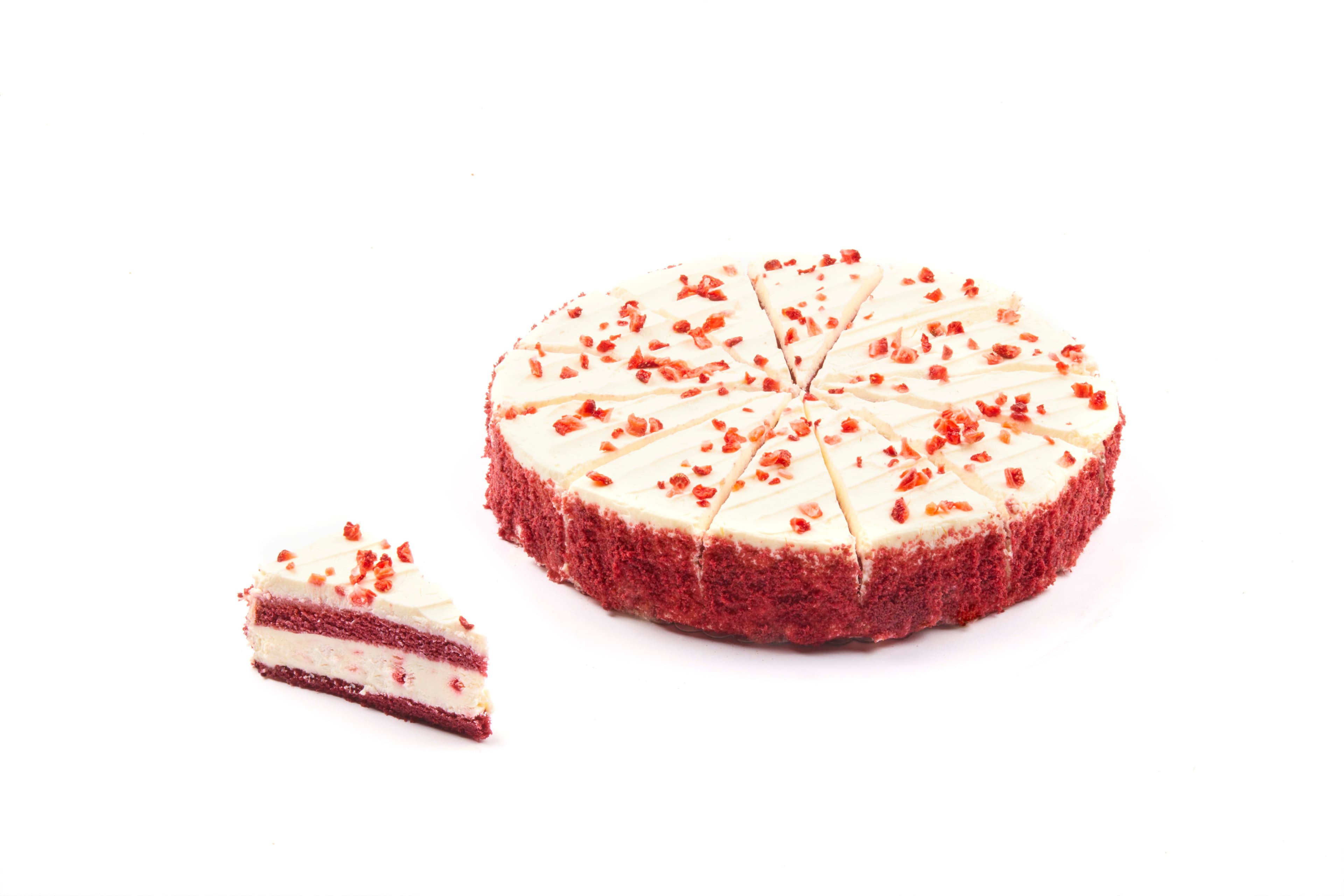 Deep-frozen strawberry red velvet cake with cream and strawberries.